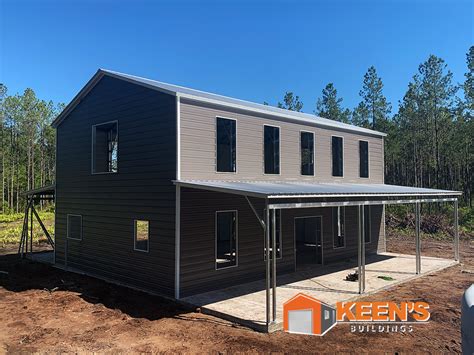 2 story cream house with porch with metal roofing|2 story metal roof exterior.